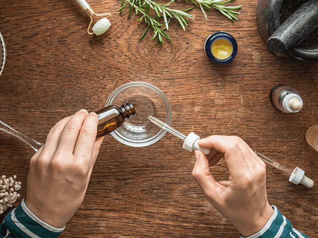 Hands mixing skincare ingredients